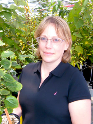 photo of Nancy Engle standing in greenhouse